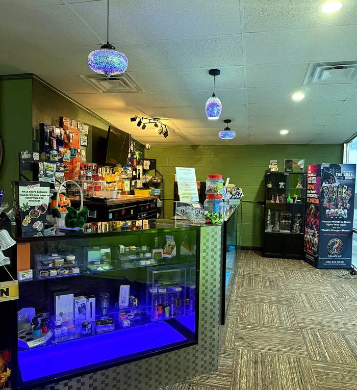 Inside Killa Cali&rsquo;s Dispensary in Poteau: glowing cases and the front counter